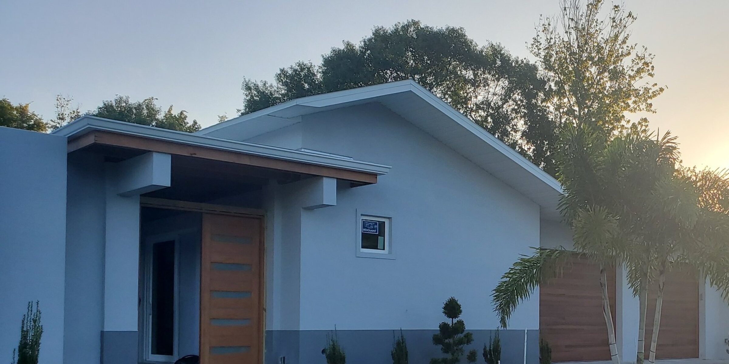 Contemporary Beach Star Construction home at golden hour