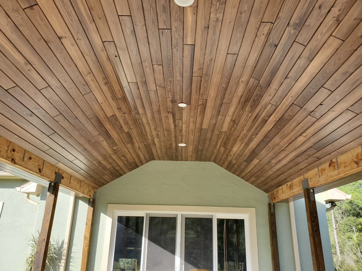 Tongue-and-groove cedar lanai ceiling on exposed timber posts